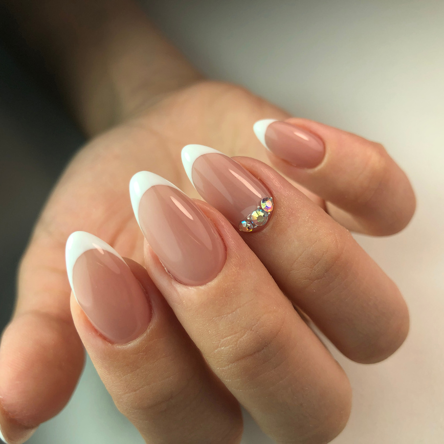 French manicure on the nails. French manicure design. Manicure gel nail polish